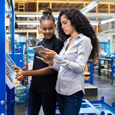 Small business owner examining equipment