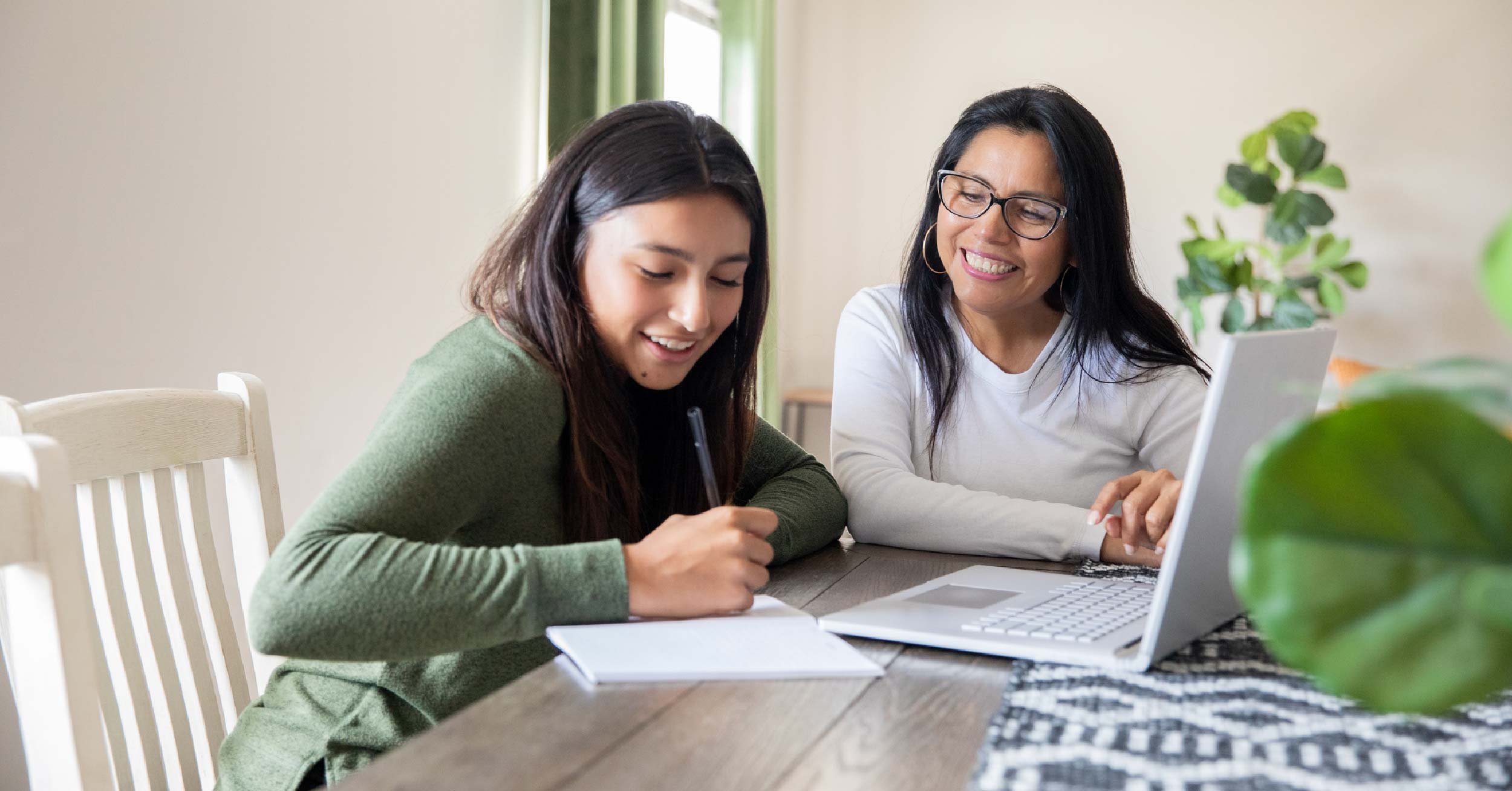 Mom and teenage daughter learning teen money management skills