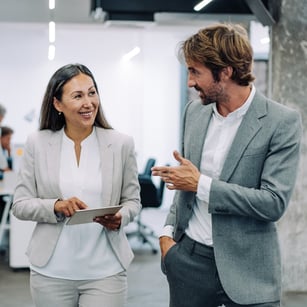 A small business owner speaking with a Stearns Bank business financing expert