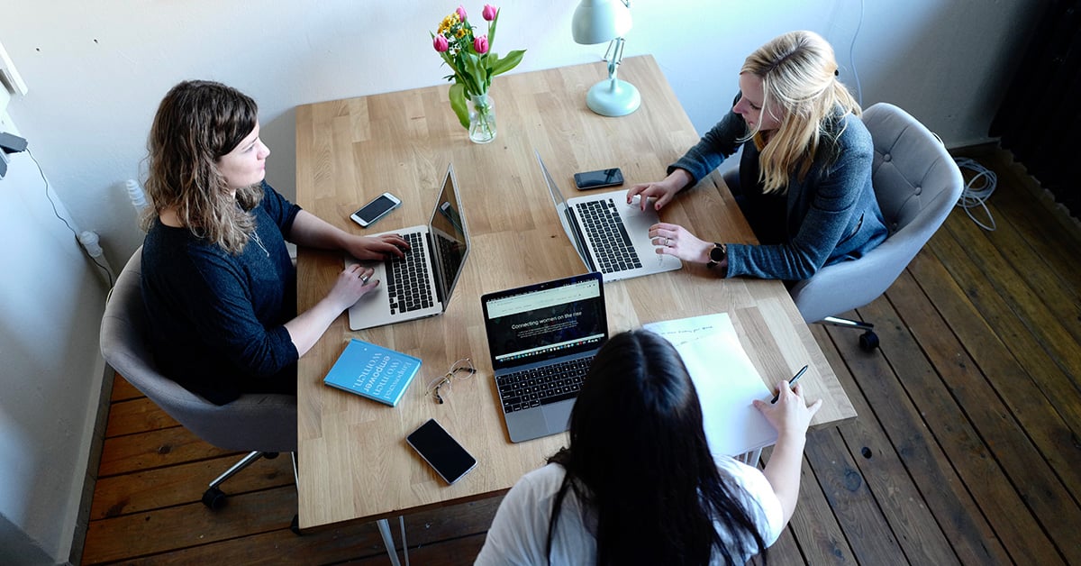 Small Business Owners At Table - Banner