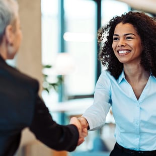 Business owner and banker shaking hands