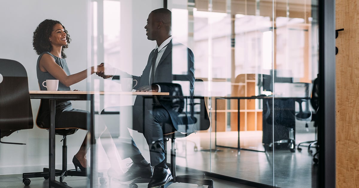 Black woman entrepreneur speaking with Stearns Bank employee