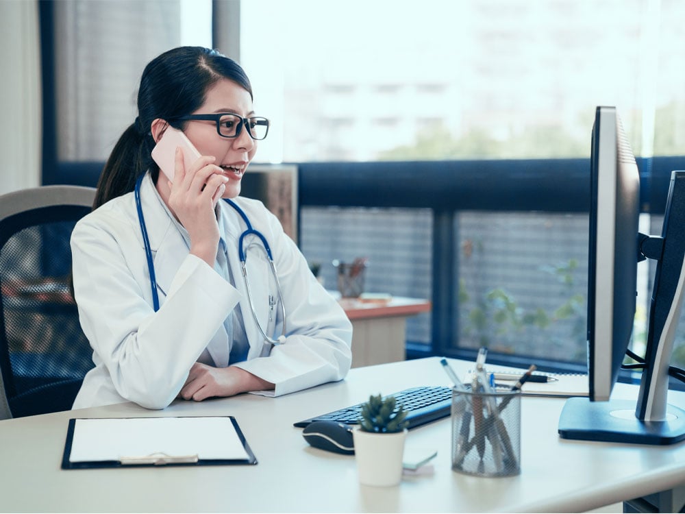 Female medical business owner on the phone with Stearns Bank 