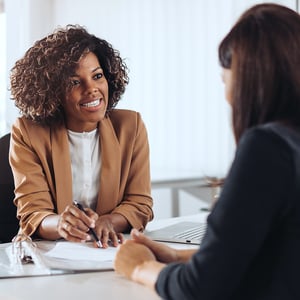 A business owner and banking discussing equipment finance agreements