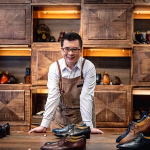 Business owner standing in his shop