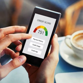 Person looking at credit score on phone