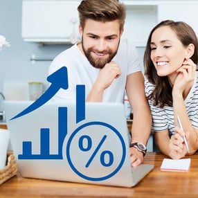 Couple looking at high-yield graphic on laptop