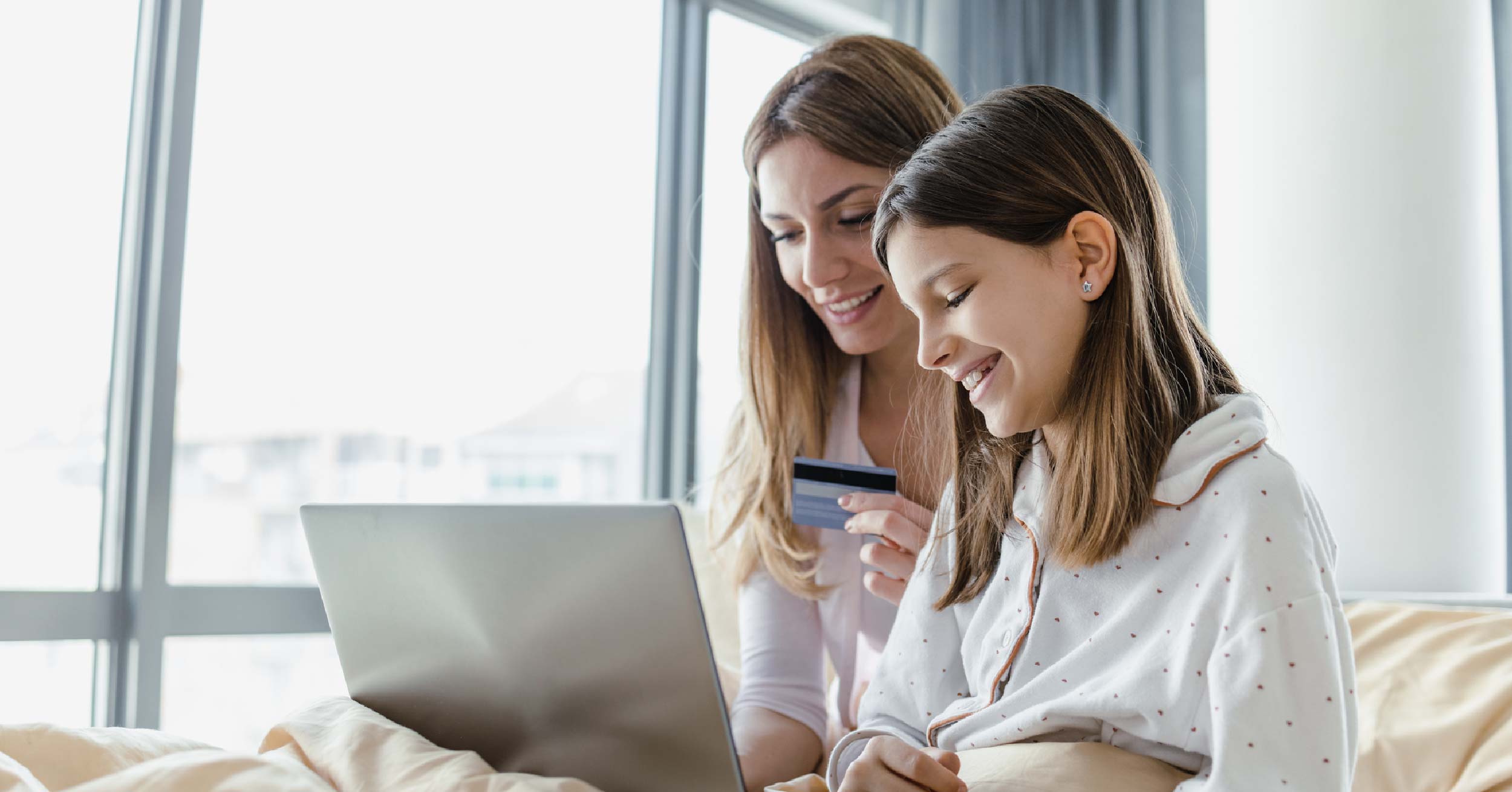 Mother and daughter opening a teen bank account