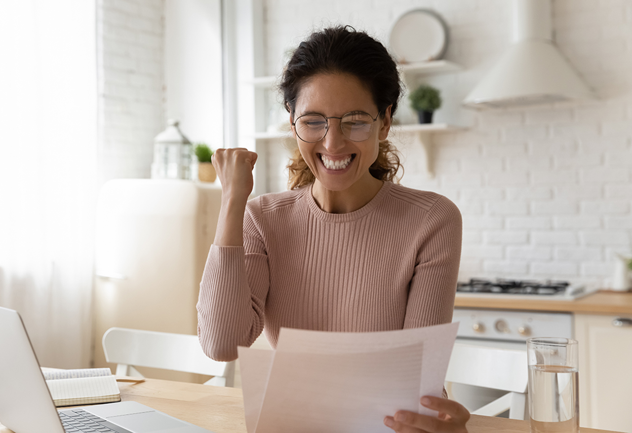 Woman celebrating increased savings