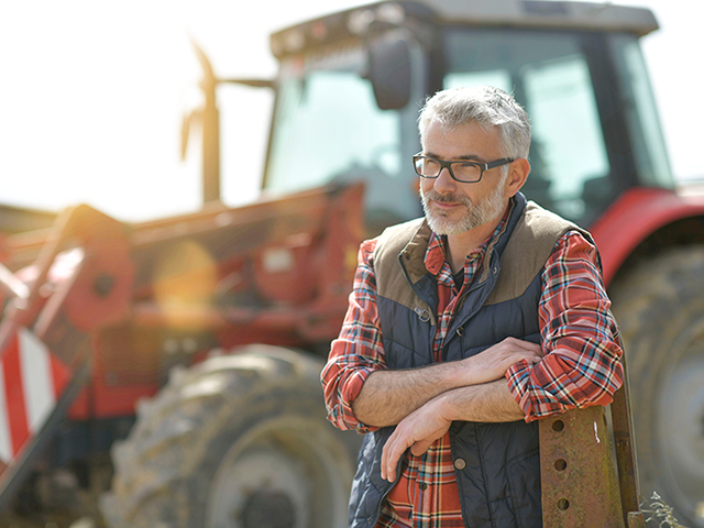 Farmer in front of his tractor