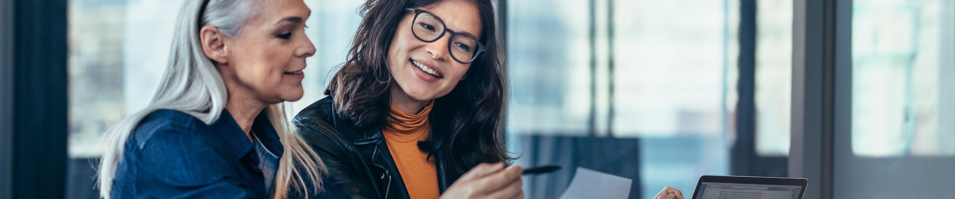 Two business women discussing Stearns Bank's small business lending program