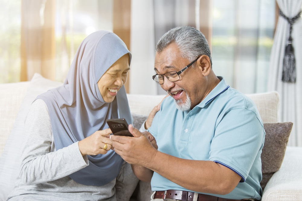 Islamic Banking - Couple with Phone