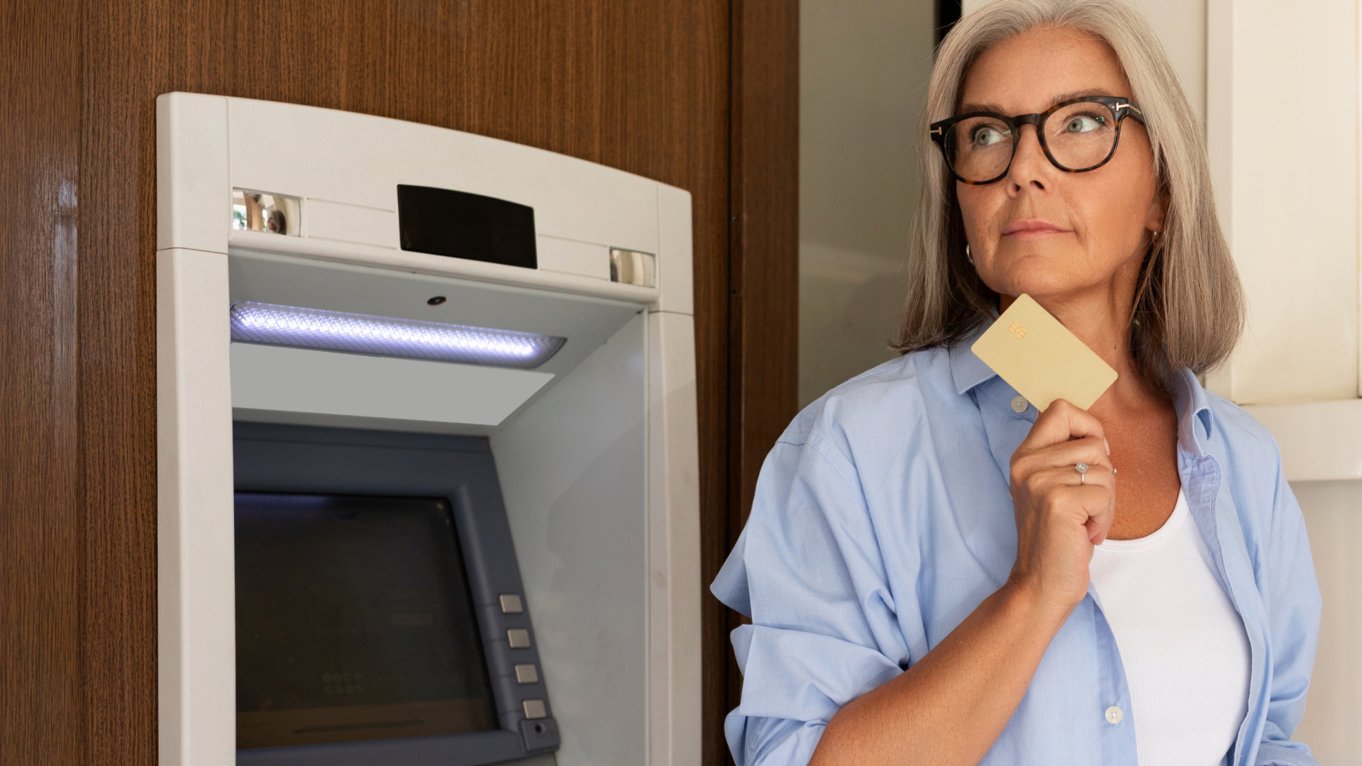 A woman using an ATM.