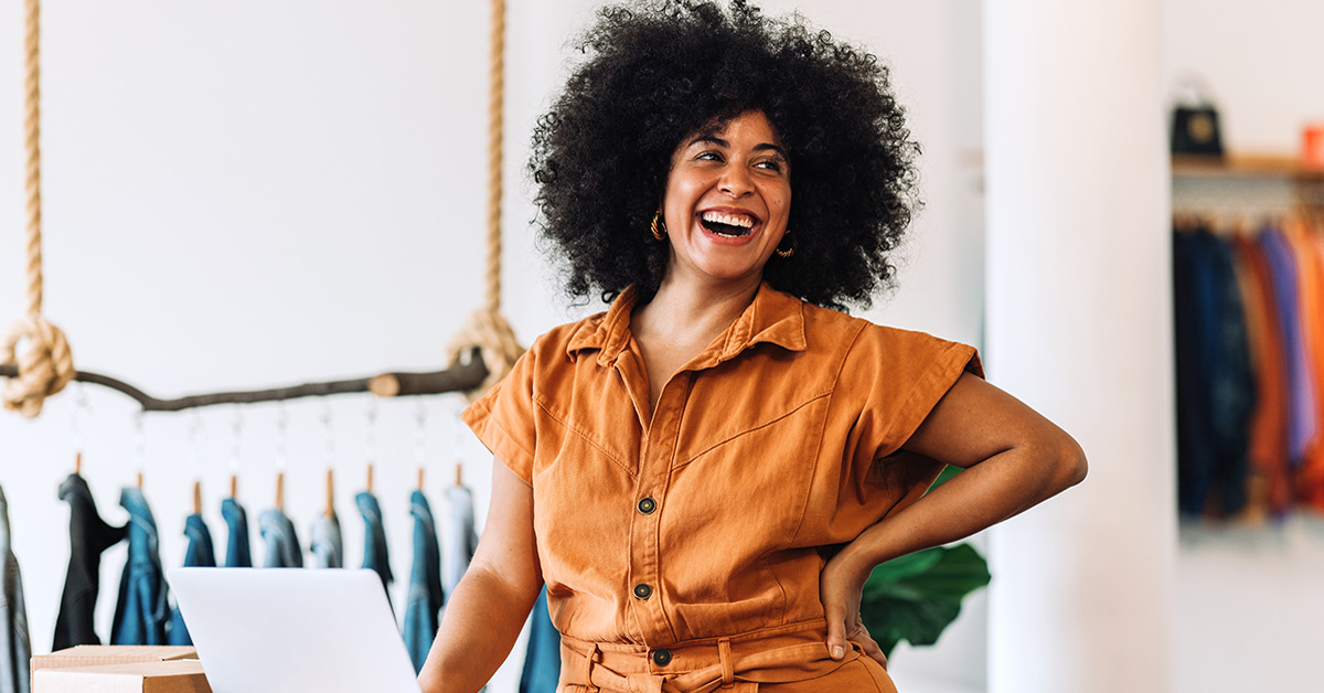 A small business owner standing in her business 