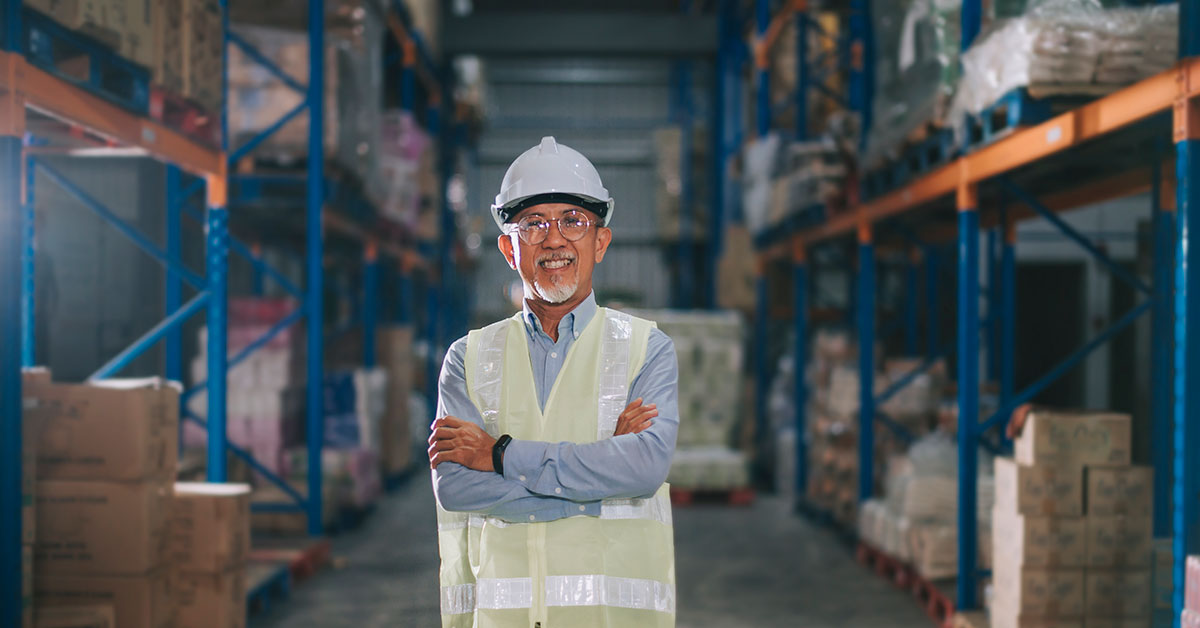 Small business owner standing in his factory 