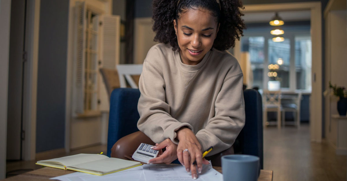 Woman looking at savings account options at paper