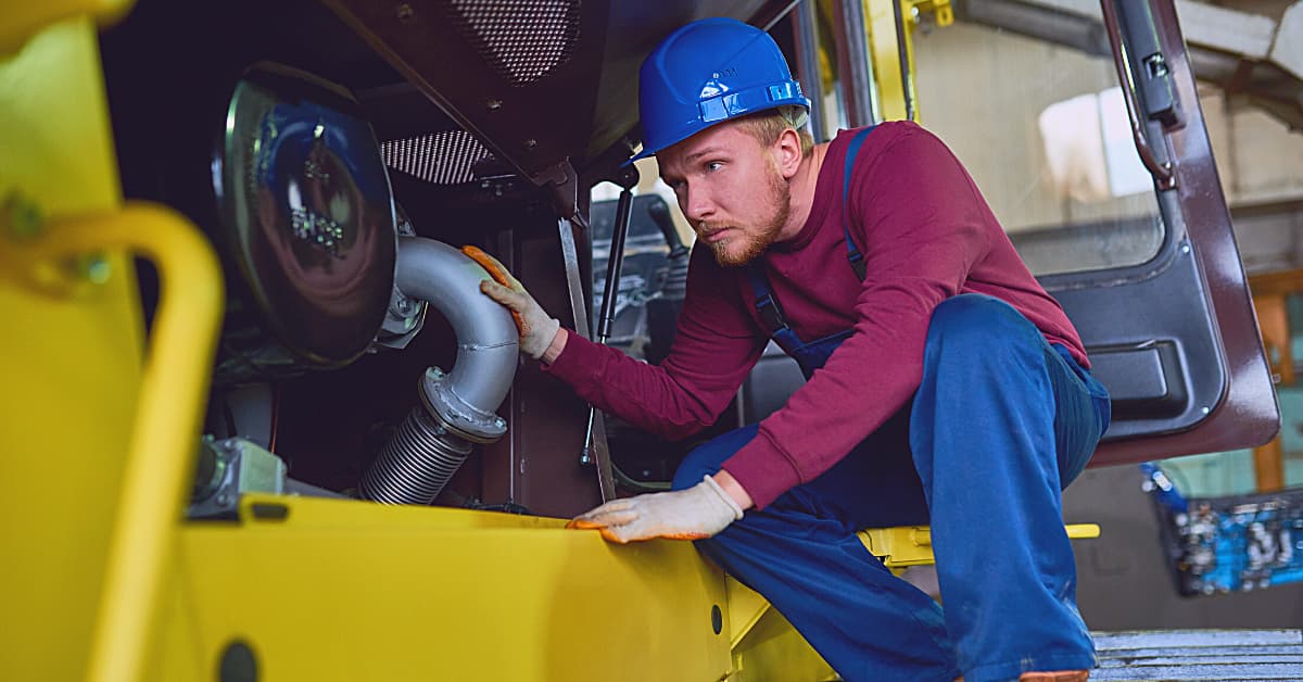 Manufacturing employee working with equipment